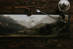 Large rubber backed bar mat by Manor Road with a landscape mountain image. With cocktail shaker and stirrer. 