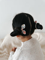 Small girls hair tie made from Liberty floral fabric. Ideal for gifting and everyday wear. 