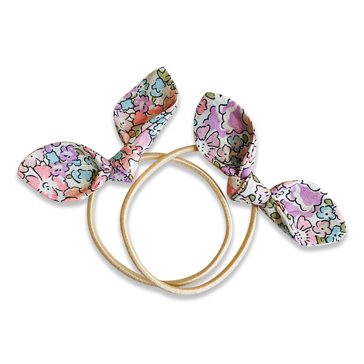 Set of Liberty floral-patterned hair ties on a white background