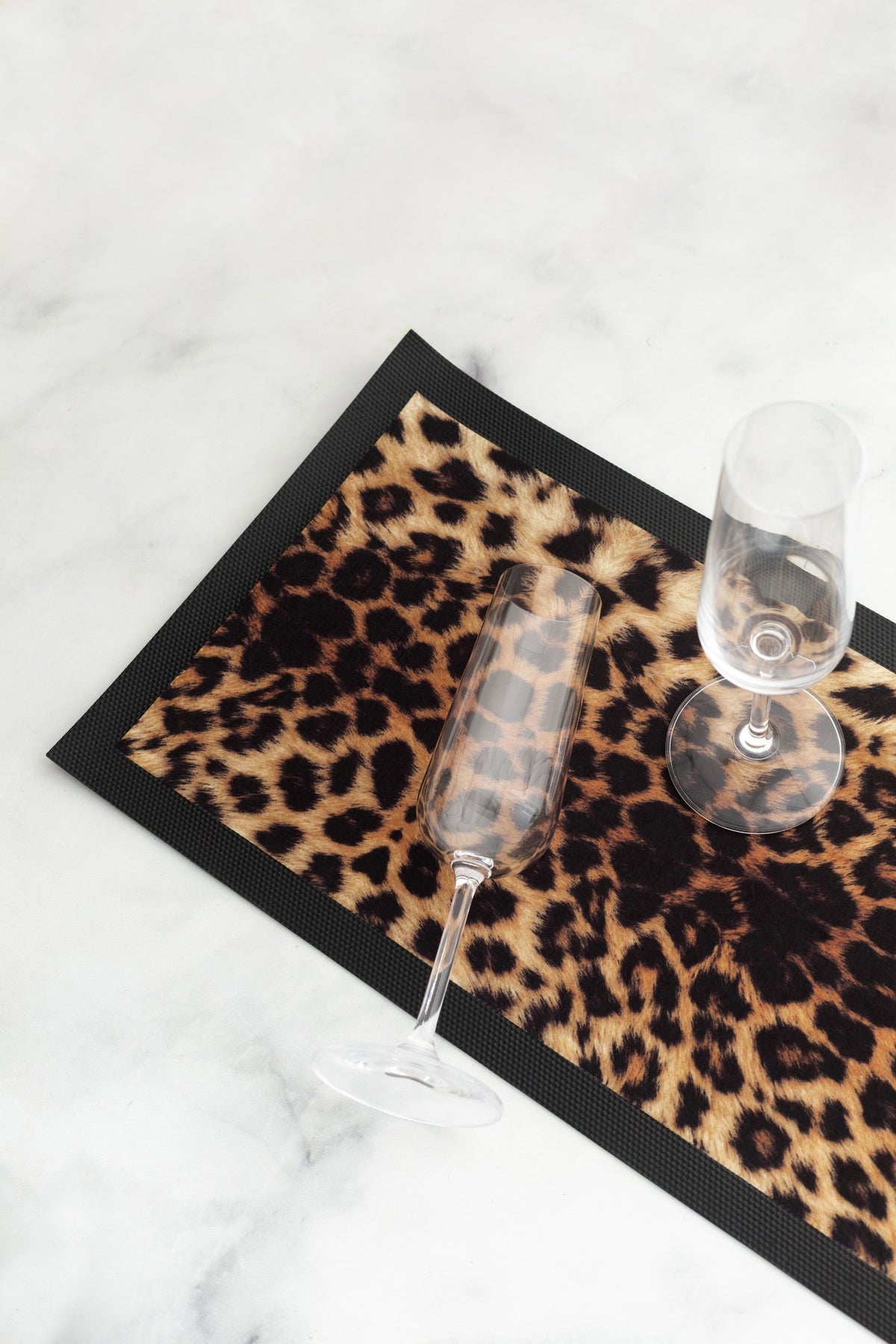 Rubber backed bar mat with stylish leopard print design. Perfect for bar and drinks areas. 