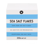 A white box of Sea Salt Flakes with light blue horizontal stripes and black text, shown on a plain white background.