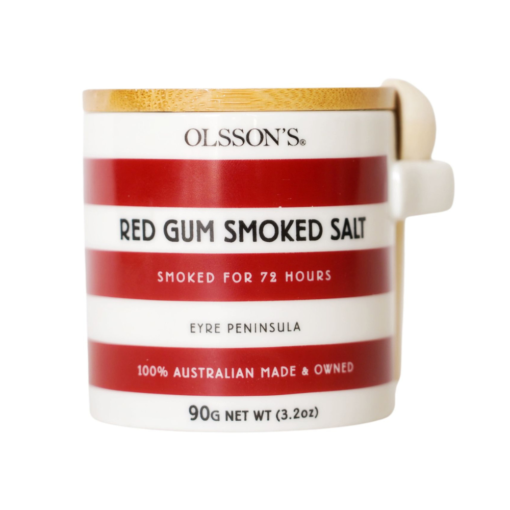 Olsson's Red Gum Smoked Salt in a white ceramic mug with red stripes, a light wood lid, and a cream-colored handle, shown on a white background.